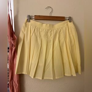 ALO Yoga - Varsity Tennis Skirt - Creamy Lemon